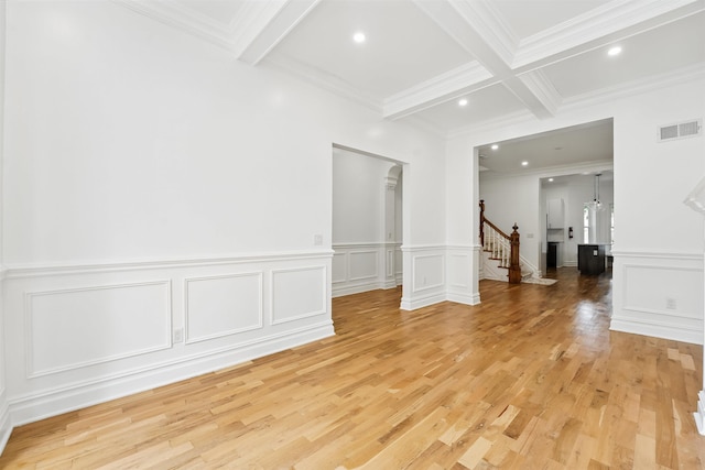 52 Brinkerhoff St, Jersey City, NJ 07304 - spare room featuring beamed ceiling, stairs, crown molding, light wood-style flooring, and a decorative wall