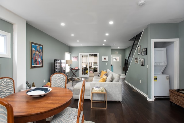 dining area with stacked washer and clothes dryer, recessed lighting, wood finished floors, baseboards, and stairs