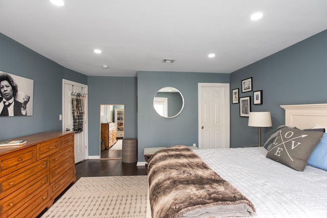 bedroom featuring dark wood-style floors, baseboards, visible vents, and recessed lighting