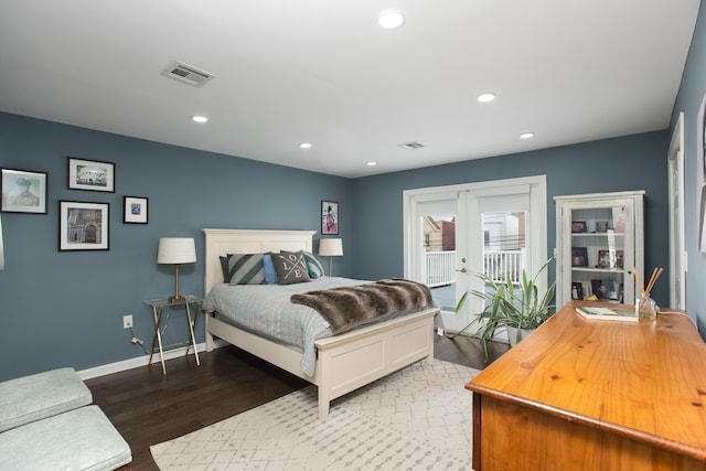 bedroom featuring access to exterior, baseboards, wood finished floors, and recessed lighting