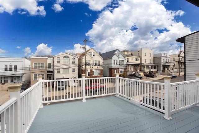 wooden deck featuring a residential view