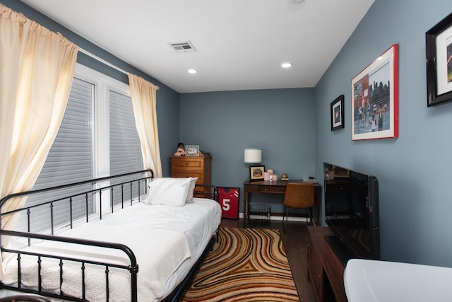 bedroom with visible vents, wood finished floors, and recessed lighting