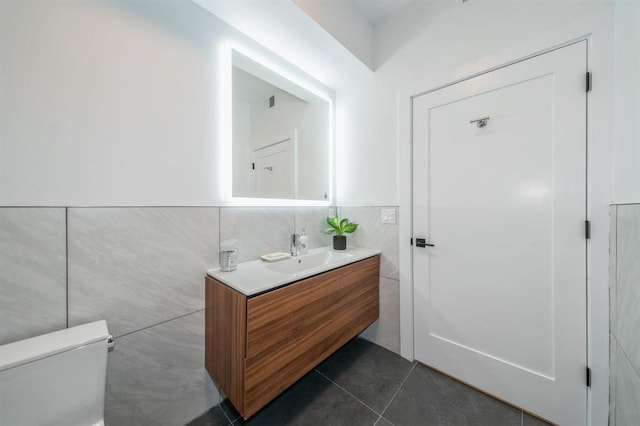 160 Brunswick St Unit 304, Jersey City, NJ 07302 - half bath featuring tile walls, vanity, and tile patterned flooring