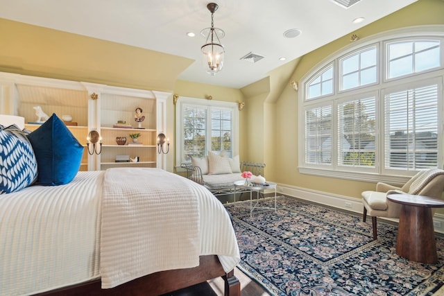 bedroom featuring an inviting chandelier, recessed lighting, visible vents, and baseboards