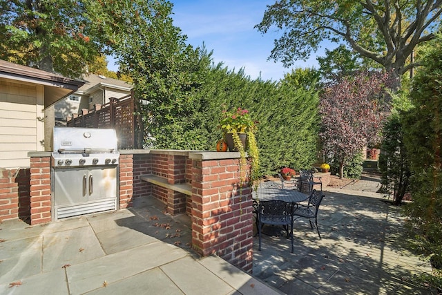 view of patio / terrace with outdoor dining space, grilling area, and area for grilling