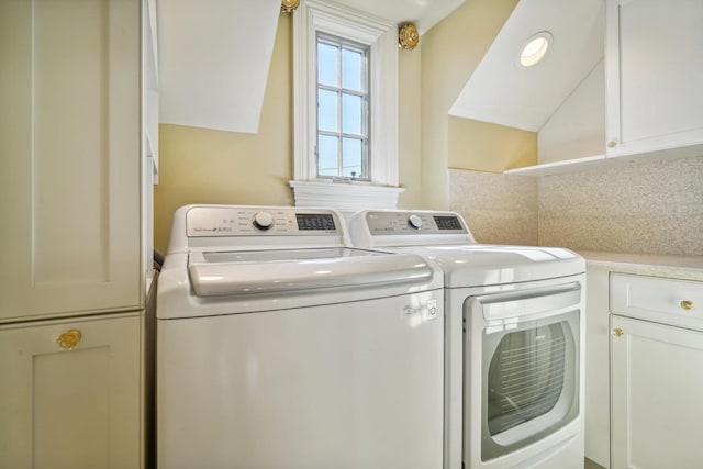 laundry area featuring cabinet space and washer and clothes dryer