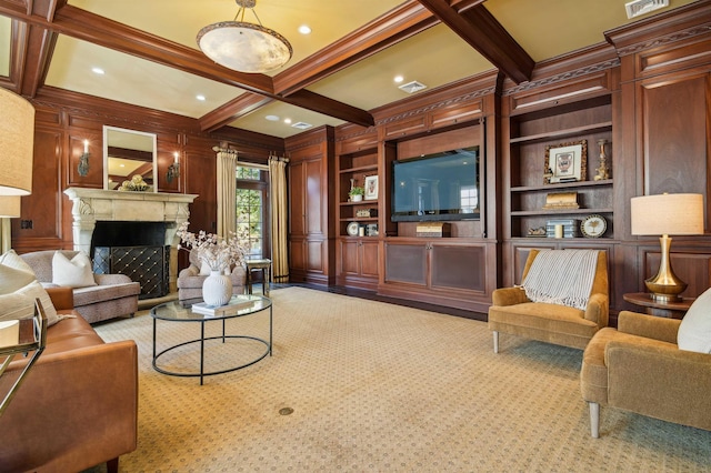 living room with built in shelves, a fireplace, a decorative wall, coffered ceiling, and beamed ceiling