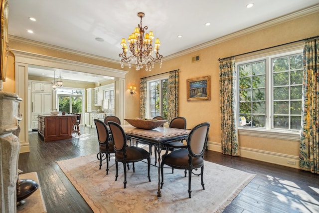 dining space featuring dark wood-style floors, plenty of natural light, and visible vents