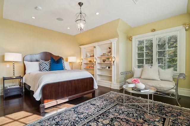 bedroom featuring recessed lighting, a notable chandelier, baseboards, and wood finished floors