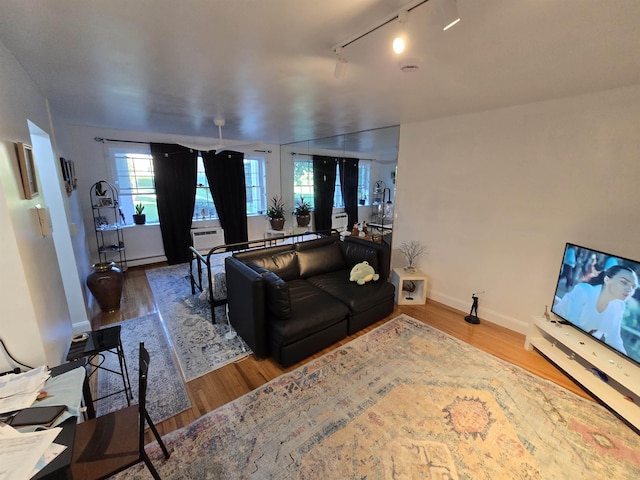 605 Grove St Unit A011, Clifton, NJ 07013 - living area featuring wood finished floors, track lighting, and baseboards
