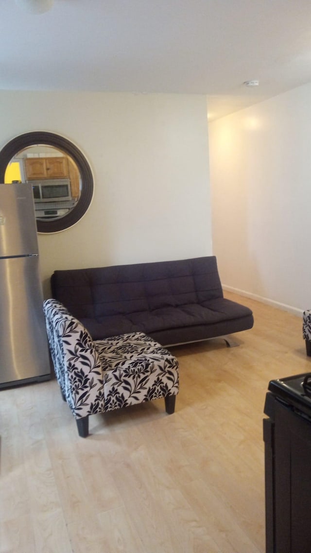 201 45th St Unit E4, Union City, NJ 07087 - living room with light wood-type flooring and baseboards
