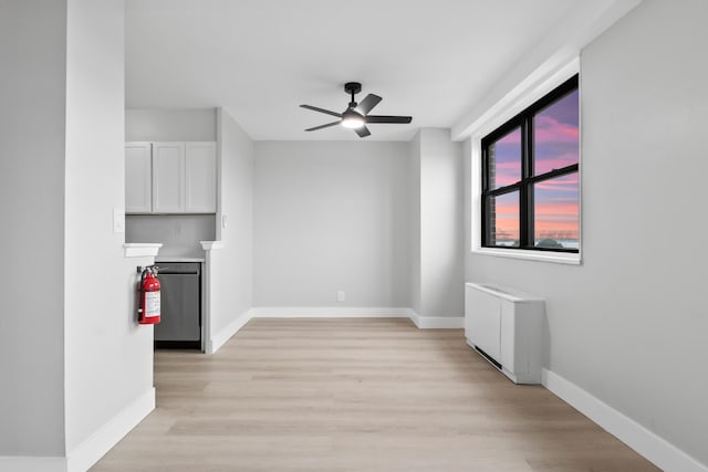 1225 Kennedy Blvd Unit 5A, Bayonne, NJ 07002 - unfurnished living room featuring ceiling fan, light wood-style floors, and baseboards
