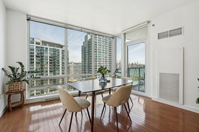 living room with hardwood / wood-style floors and expansive windows