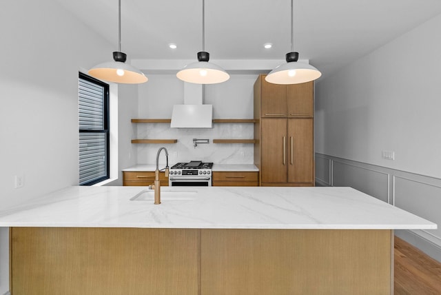 166 New York Ave, Jersey City, NJ 07307 - kitchen featuring open shelves, brown cabinets, high end stove, a peninsula, and light stone counters