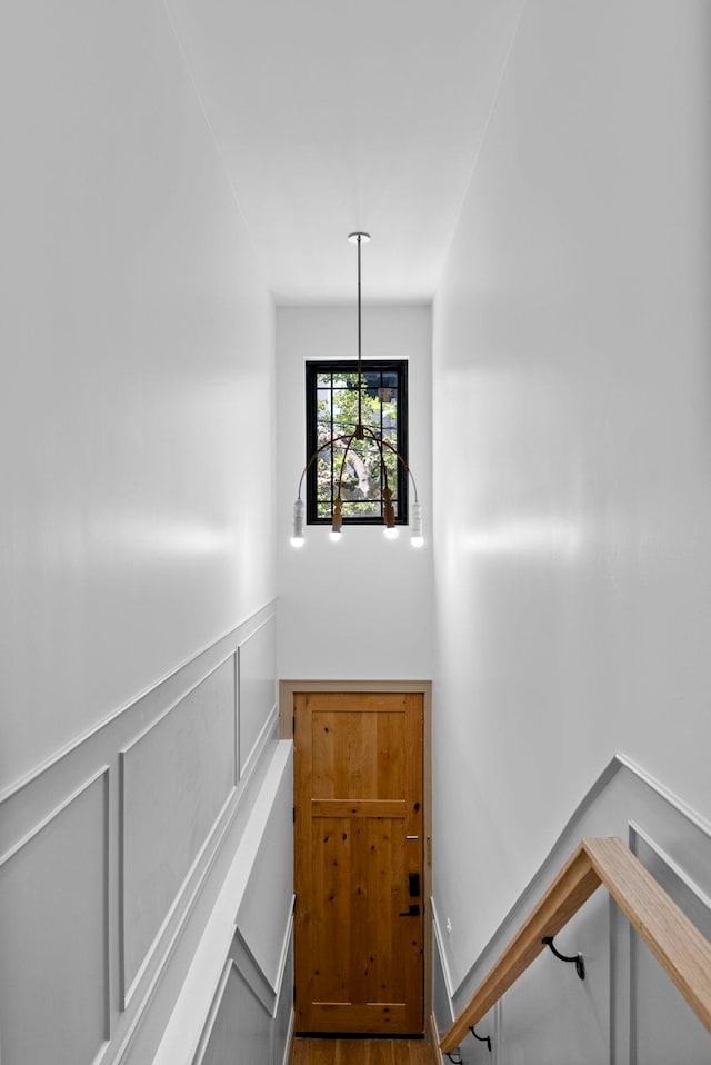 166 New York Ave, Jersey City, NJ 07307 - stairway featuring wainscoting, wood finished floors, and a decorative wall