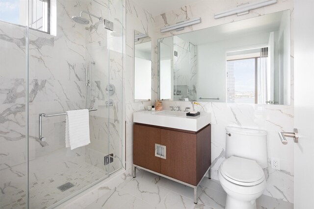 bathroom featuring vanity, toilet, walk in shower, and tile walls