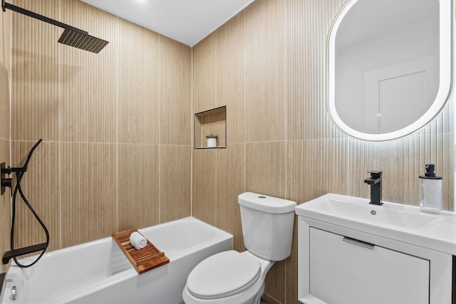 bathroom featuring toilet,  shower combination, and vanity