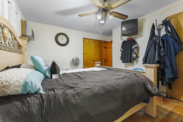 bedroom with ceiling fan and wood finished floors