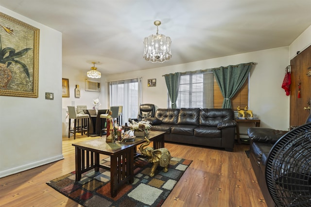 living room featuring a chandelier and hardwood / wood-style floors