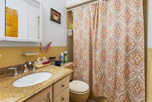 full bath with a shower with shower curtain, tile walls, toilet, and vanity