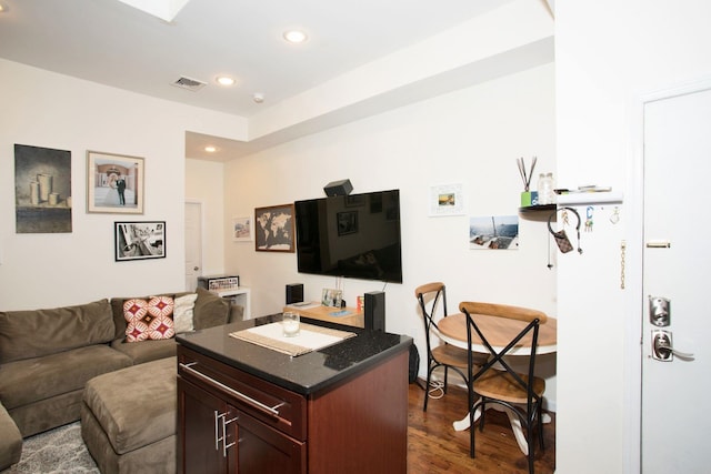 living room with dark hardwood / wood-style flooring