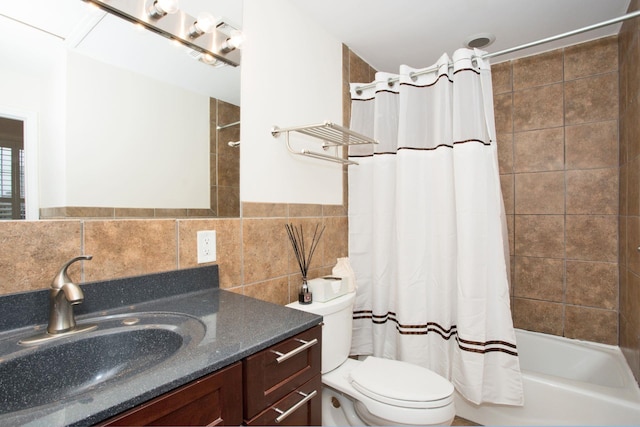 full bathroom with vanity, shower / tub combo, and toilet