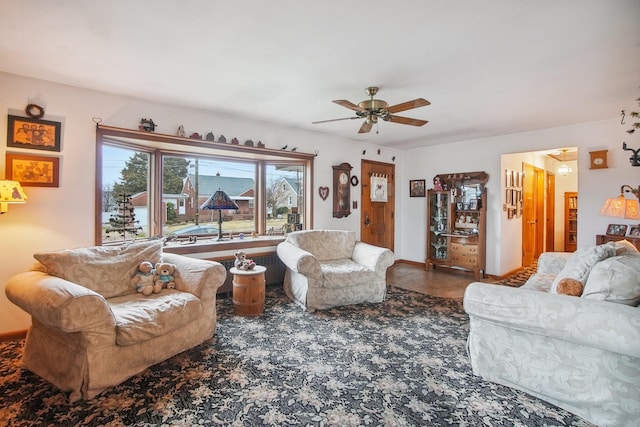 living room featuring a ceiling fan