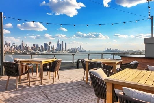 wooden deck featuring a water view