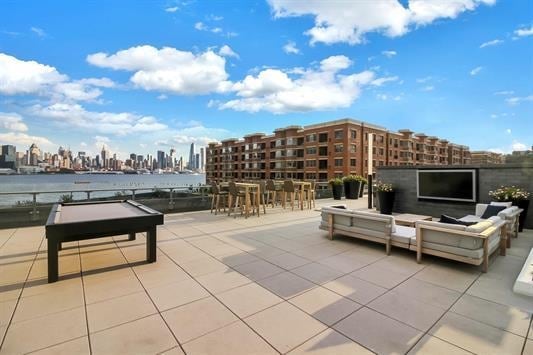 view of patio featuring exterior bar and an outdoor hangout area