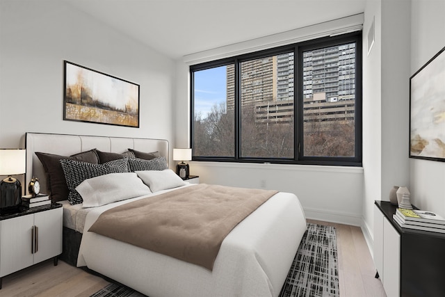 bedroom with light hardwood / wood-style flooring