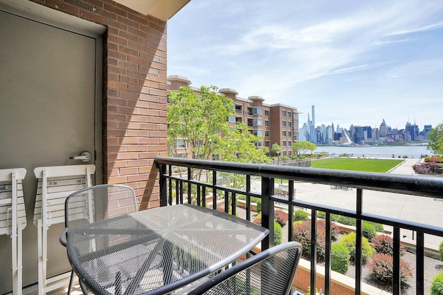 20 Avenue At Port Imperial Unit 217, West New York, NJ 07093 - balcony with outdoor dining area, a skyline view, and a water view