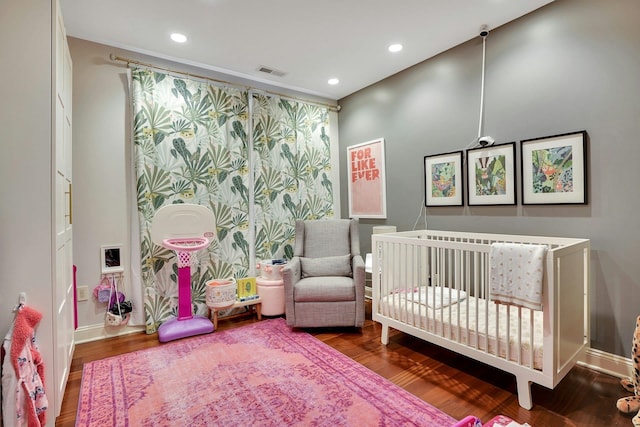 20 Avenue At Port Imperial Unit 217, West New York, NJ 07093 - bedroom with wood finished floors, recessed lighting, and a crib