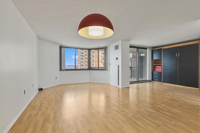 empty room featuring hardwood / wood-style flooring