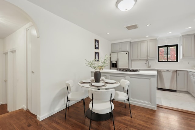 48 W Hamilton Pl Unit 5, Jersey City, NJ 07302 - dining space with light wood-style flooring, arched walkways, and recessed lighting