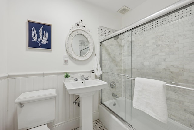 48 W Hamilton Pl Unit 5, Jersey City, NJ 07302 - full bathroom featuring combined bath / shower with glass door and a wainscoted wall