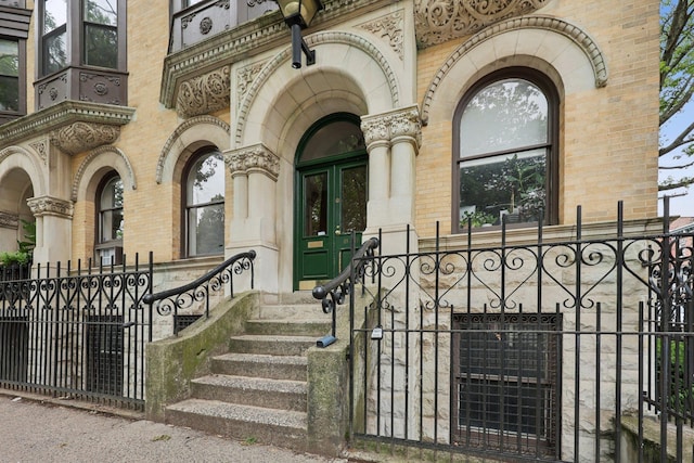 48 W Hamilton Pl Unit 5, Jersey City, NJ 07302 - property entrance featuring brick siding, a gate, and stone siding
