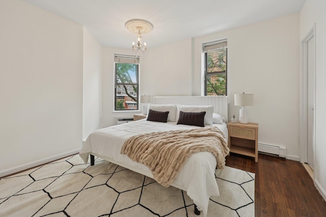 48 W Hamilton Pl Unit 5, Jersey City, NJ 07302 - bedroom with baseboard heating, a chandelier, and wood finished floors