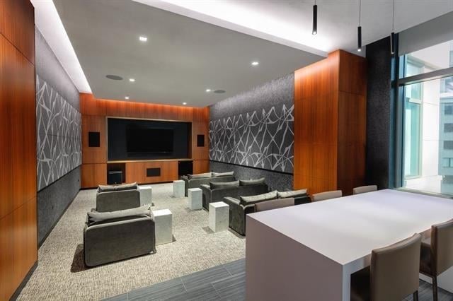 99 Hudson St Unit 401, Jersey City, NJ 07302 - cinema with an accent wall and recessed lighting