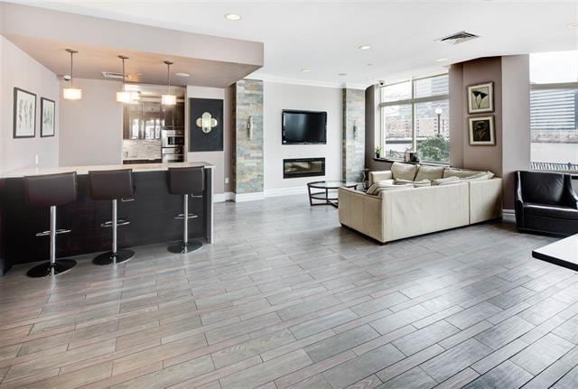 living room featuring a large fireplace