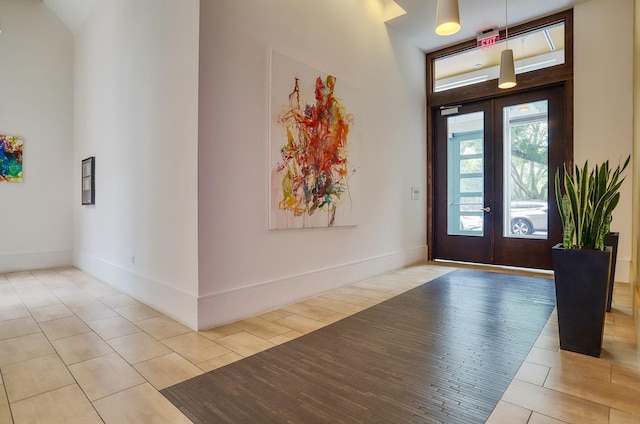 25 Mcwilliams Pl Unit 402, Jersey City, NJ 07302 - foyer entrance featuring french doors, a towering ceiling, and tile patterned floors