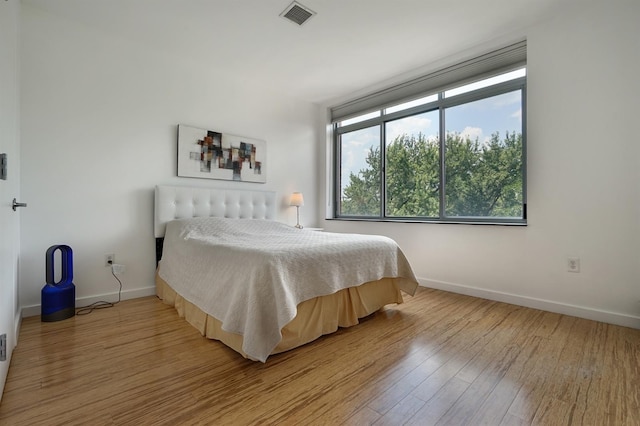 25 Mcwilliams Pl Unit 402, Jersey City, NJ 07302 - bedroom with baseboards, light wood finished floors, and visible vents