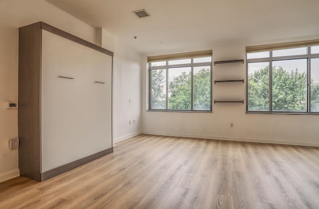 25 Mcwilliams Pl Unit 402, Jersey City, NJ 07302 - unfurnished bedroom featuring light wood-style flooring and baseboards