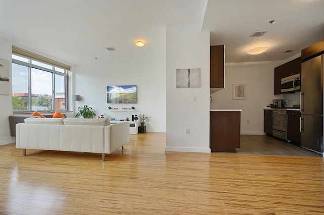 25 Mcwilliams Pl Unit 402, Jersey City, NJ 07302 - living area featuring light wood-style floors, baseboards, and visible vents