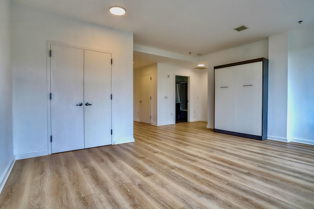 25 Mcwilliams Pl Unit 402, Jersey City, NJ 07302 - unfurnished bedroom featuring light wood finished floors and a closet