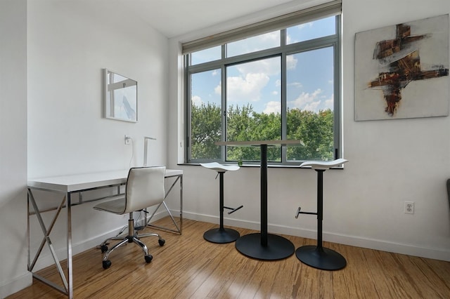 25 Mcwilliams Pl Unit 402, Jersey City, NJ 07302 - office space featuring baseboards, wood finished floors, and a healthy amount of sunlight