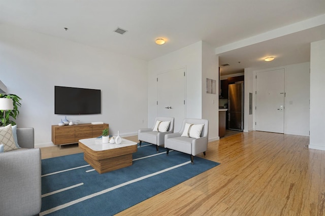 25 Mcwilliams Pl Unit 402, Jersey City, NJ 07302 - living area featuring baseboards, visible vents, and wood finished floors