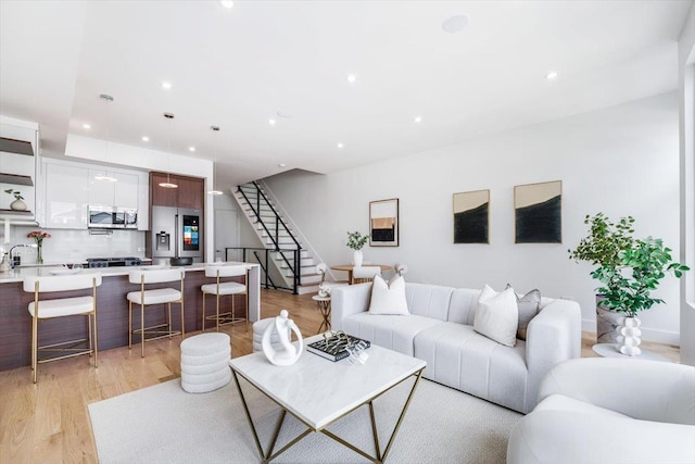 91 Pearsall Ave Unit 2, Jersey City, NJ 07305 - living room featuring stairs, recessed lighting, and light wood-style flooring