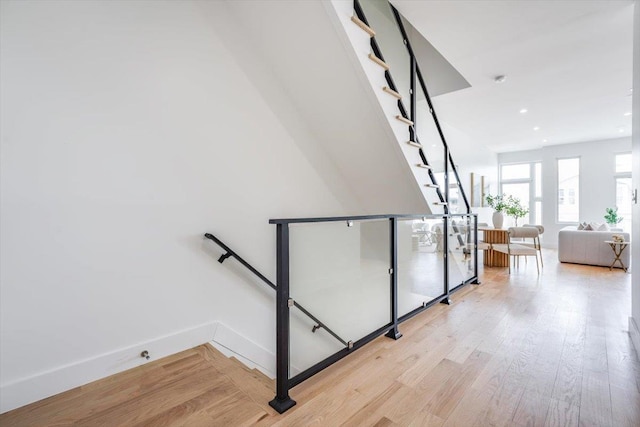 91 Pearsall Ave Unit 2, Jersey City, NJ 07305 - stairway with recessed lighting, baseboards, and wood finished floors
