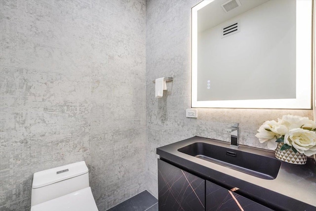 91 Pearsall Ave Unit 2, Jersey City, NJ 07305 - half bathroom featuring vanity, toilet, and visible vents