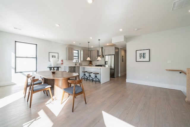 dining room with light hardwood / wood-style flooring